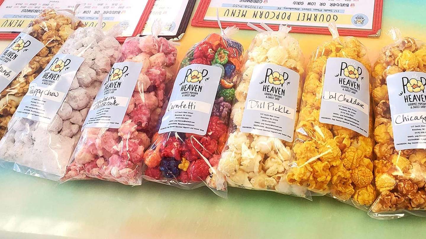 Row of assorted bags of gourmet popcorn